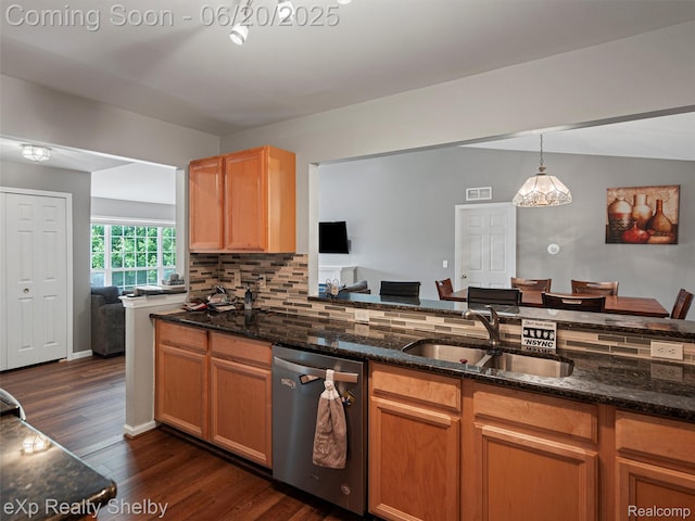 16436 Grandview Dr, Macomb, MI 48044 - kitchen with stainless steel dishwasher, dark stone counters, dark wood-type flooring, hanging light fixtures, and tasteful backsplash