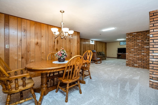 2729 Horton Ct, Niles, MI 49120 - carpeted dining area featuring wood walls, brick wall, and a chandelier