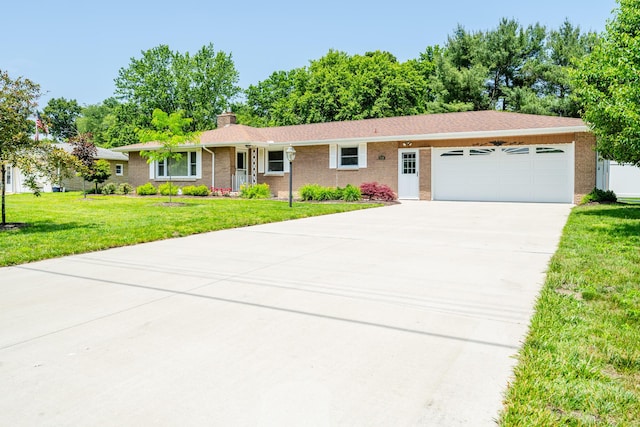 2729 Horton Ct, Niles, MI 49120 - ranch-style home with a garage, a chimney, driveway, a front lawn, and brick siding