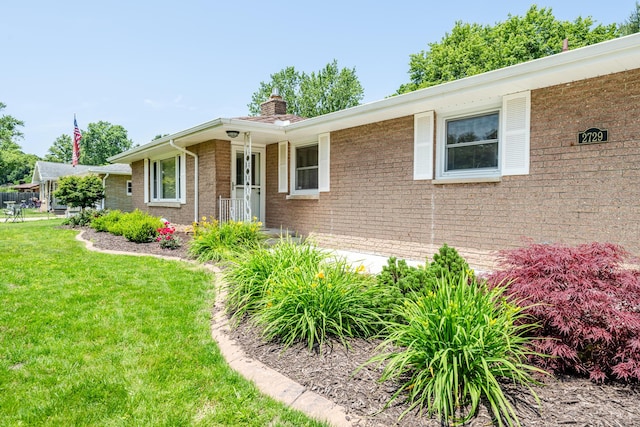 2729 Horton Ct, Niles, MI 49120 - ranch-style house with a chimney, a front lawn, and brick siding