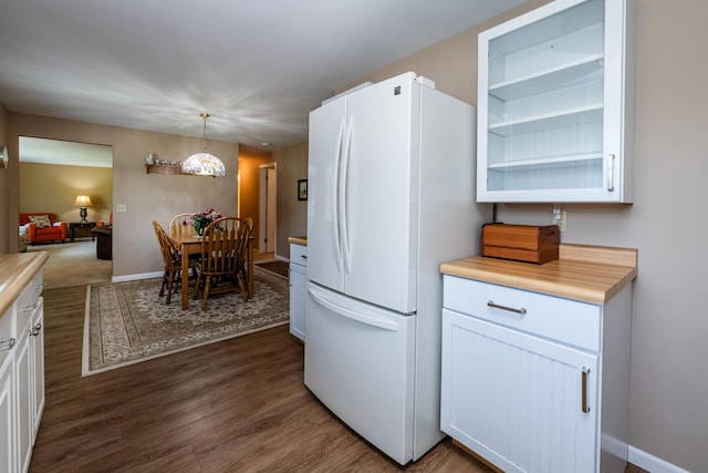 2729 Horton Ct, Niles, MI 49120 - kitchen featuring freestanding refrigerator, light countertops, dark wood-style floors, and white cabinets