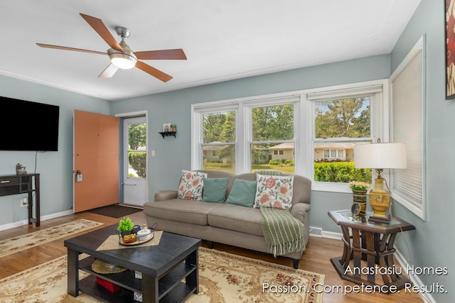 4516 Burgis Ave SE, Grand Rapids, MI 49508 - living area featuring wood finished floors and ceiling fan