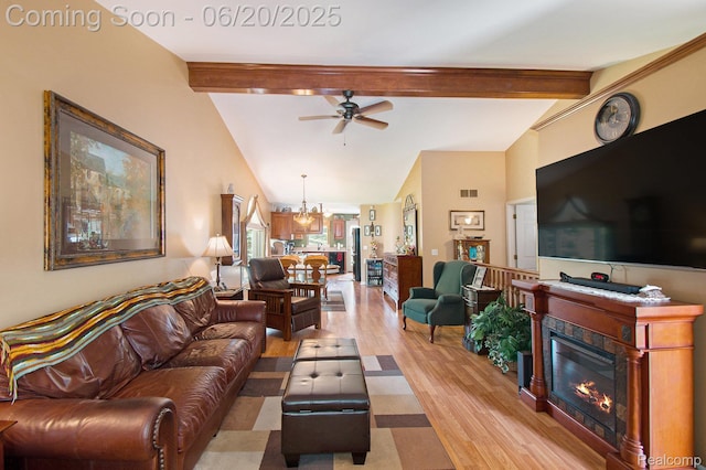 6073 Belmont Ct E, Grand Blanc, MI 48439 - living area featuring ceiling fan, light wood-style floors, a chandelier, and a glass covered fireplace