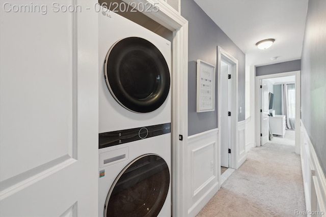 1920 Rowland Ave, Royal Oak, MI 48067 - laundry area featuring stacked washer / dryer and light colored carpet