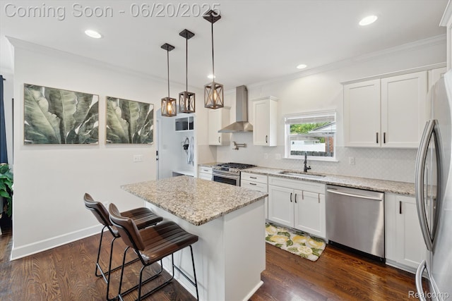 1920 Rowland Ave, Royal Oak, MI 48067 - kitchen with stainless steel appliances, wall chimney range hood, tasteful backsplash, a center island, and crown molding