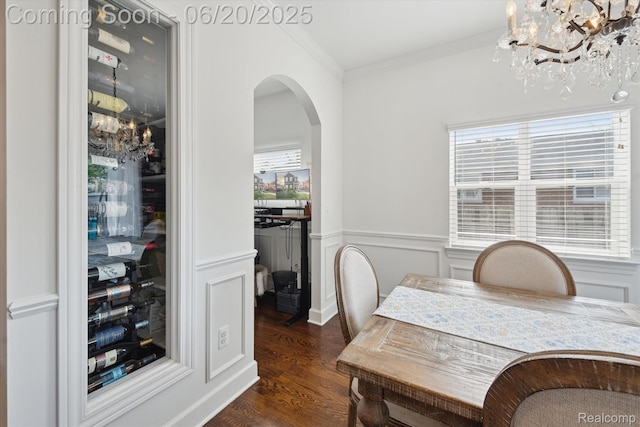 1920 Rowland Ave, Royal Oak, MI 48067 - dining room with a chandelier, dark wood-style floors, crown molding, arched walkways, and a wainscoted wall