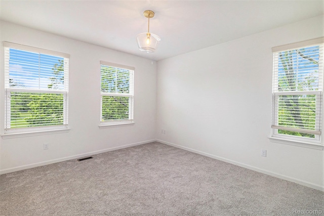478 N Wixom Rd, Wixom, MI 48393 - carpeted spare room featuring baseboards