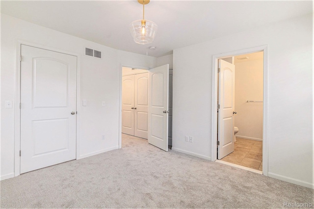 478 N Wixom Rd, Wixom, MI 48393 - unfurnished bedroom with carpet flooring and ensuite bath