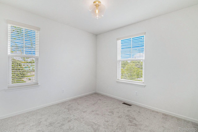 478 N Wixom Rd, Wixom, MI 48393 - carpeted empty room featuring baseboards