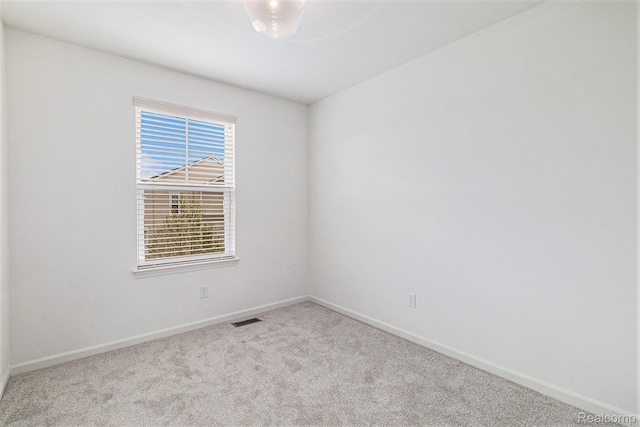 478 N Wixom Rd, Wixom, MI 48393 - carpeted spare room featuring baseboards