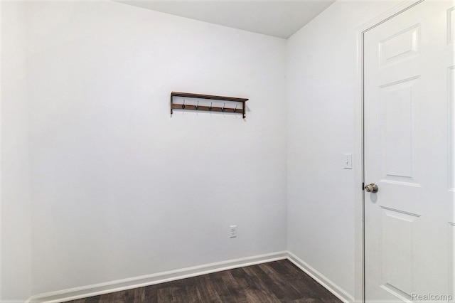 478 N Wixom Rd, Wixom, MI 48393 - spare room featuring dark wood-style floors and baseboards
