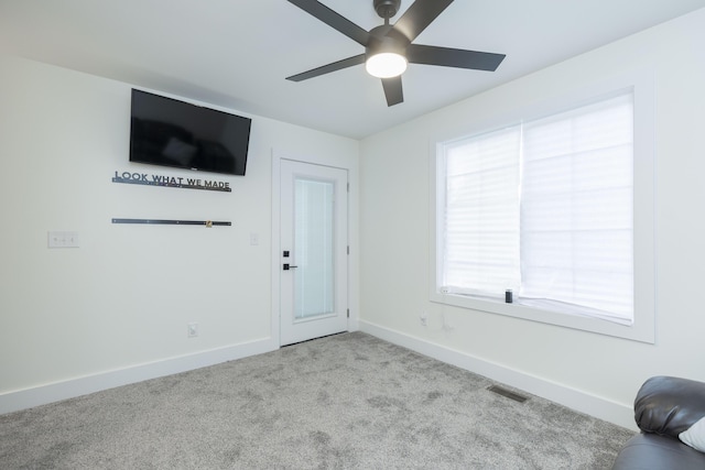 21536 Fieldview Dr, Edwardsburg, MI 49112 - unfurnished living room with a ceiling fan and carpet flooring