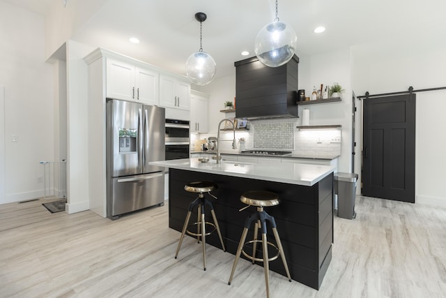 21536 Fieldview Dr, Edwardsburg, MI 49112 - kitchen with stainless steel appliances, open shelves, custom exhaust hood, decorative backsplash, and light countertops