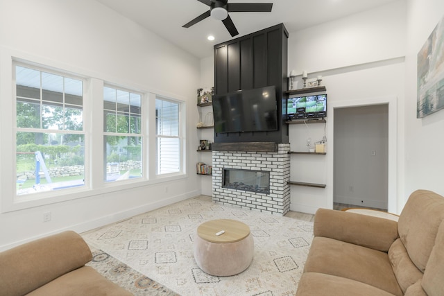 21536 Fieldview Dr, Edwardsburg, MI 49112 - living room featuring a ceiling fan, healthy amount of natural light, a large fireplace, and recessed lighting