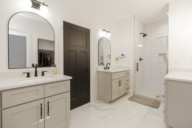 21536 Fieldview Dr, Edwardsburg, MI 49112 - bathroom featuring a stall shower, two vanities, marble look tiles, and a spacious closet