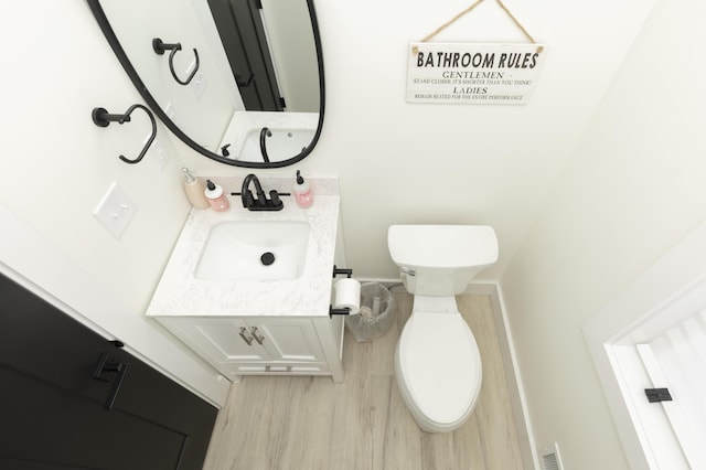 21536 Fieldview Dr, Edwardsburg, MI 49112 - bathroom featuring wood finished floors and vanity