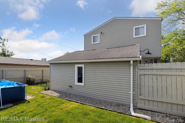 1972 Theodore St, Trenton, MI 48183 - rear view of property featuring roof with shingles