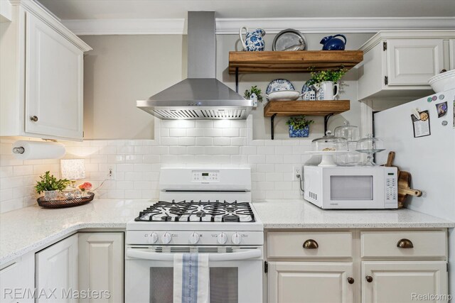 1972 Theodore St, Trenton, MI 48183 - kitchen featuring white appliances, wall chimney range hood, open shelves, crown molding, and white cabinets