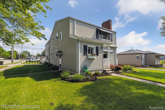 1972 Theodore St, Trenton, MI 48183 - dutch colonial with a chimney and a front yard