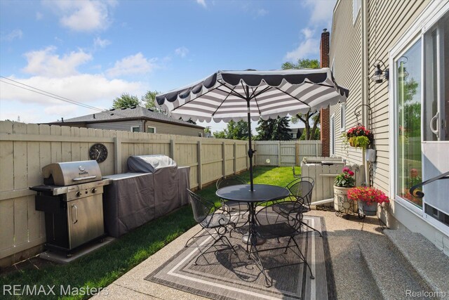 1972 Theodore St, Trenton, MI 48183 - fenced backyard with a patio, area for grilling, and outdoor dining space