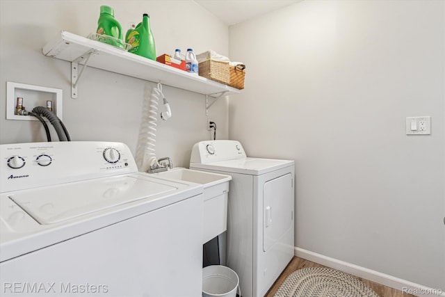 1972 Theodore St, Trenton, MI 48183 - laundry area with washer and dryer and light wood finished floors