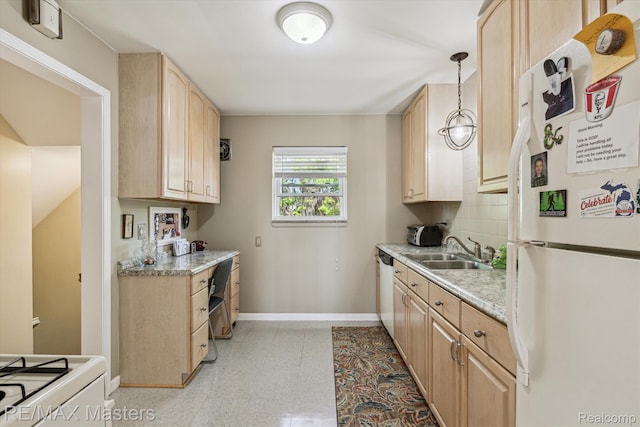 1972 Theodore St, Trenton, MI 48183 - kitchen with white appliances, light brown cabinets, light countertops, decorative backsplash, and decorative light fixtures