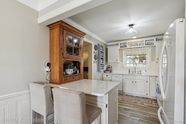1972 Theodore St, Trenton, MI 48183 - kitchen with white appliances, open shelves, white cabinetry, tasteful backsplash, and light stone counters