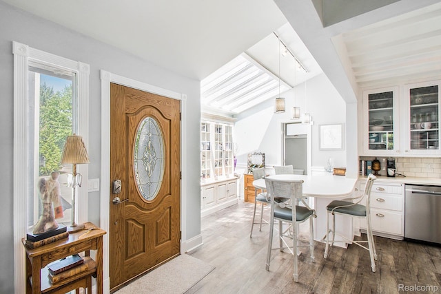 11501 Torrey Rd, Fenton, MI 48430 - entrance foyer with plenty of natural light, light wood finished floors, and vaulted ceiling