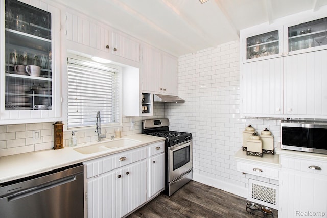11501 Torrey Rd, Fenton, MI 48430 - kitchen with stainless steel appliances, decorative backsplash, light countertops, and dark wood-style floors