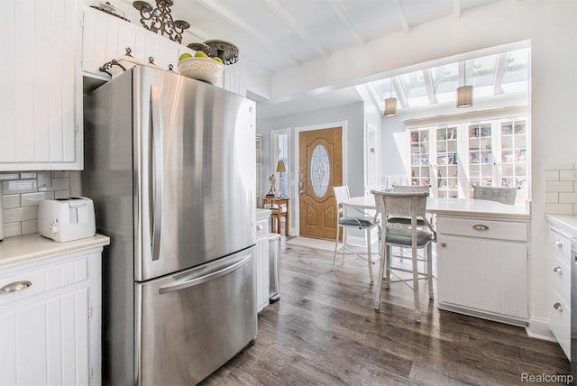 11501 Torrey Rd, Fenton, MI 48430 - kitchen featuring freestanding refrigerator, decorative backsplash, dark wood finished floors, beam ceiling, and light countertops