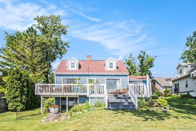11501 Torrey Rd, Fenton, MI 48430 - back of house featuring a wooden deck, a chimney, a yard, and board and batten siding