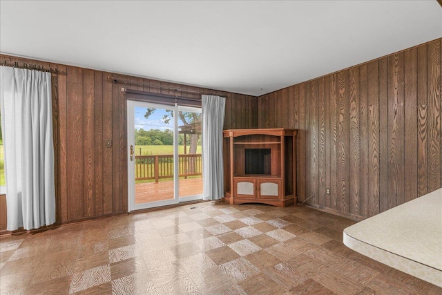 360 Wood Creek Dr, Howell, MI 48843 - unfurnished living room featuring wood walls
