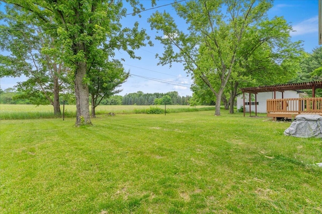 360 Wood Creek Dr, Howell, MI 48843 - view of grassy yard featuring a deck and a pergola