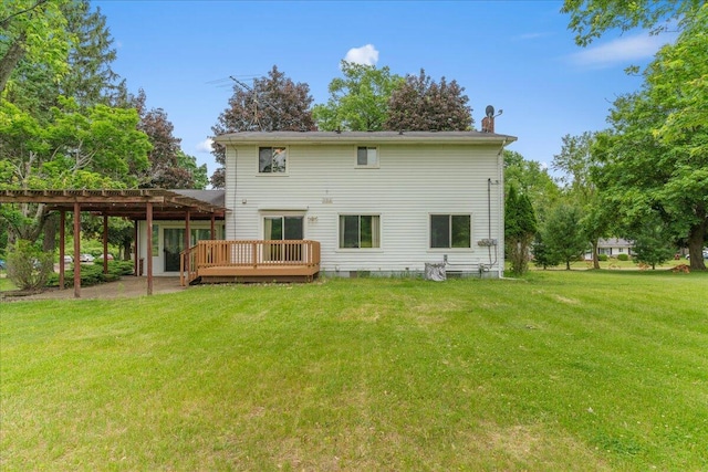 360 Wood Creek Dr, Howell, MI 48843 - back of property featuring a lawn and a deck