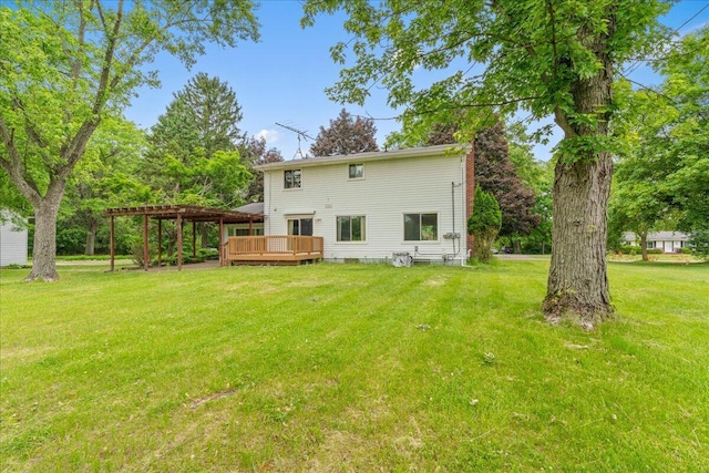 360 Wood Creek Dr, Howell, MI 48843 - back of property featuring a deck, a lawn, and a chimney