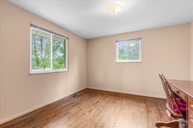 360 Wood Creek Dr, Howell, MI 48843 - unfurnished office featuring wood finished floors