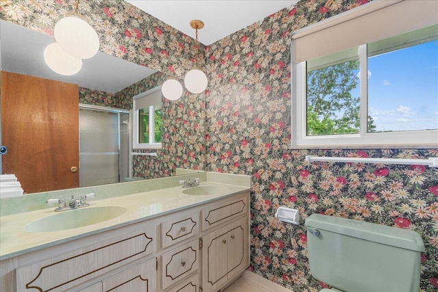 360 Wood Creek Dr, Howell, MI 48843 - bathroom featuring wallpapered walls, a shower stall, and double vanity