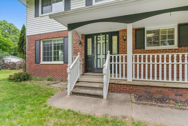 360 Wood Creek Dr, Howell, MI 48843 - property entrance with brick siding and a porch