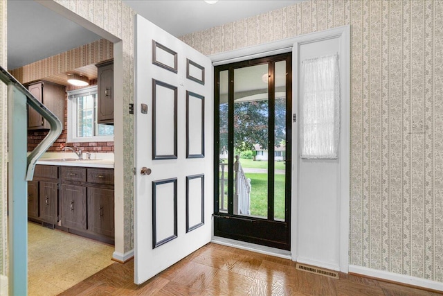 360 Wood Creek Dr, Howell, MI 48843 - entryway featuring wallpapered walls and baseboards