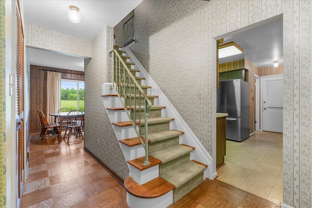360 Wood Creek Dr, Howell, MI 48843 - stairs featuring wallpapered walls and tile patterned floors