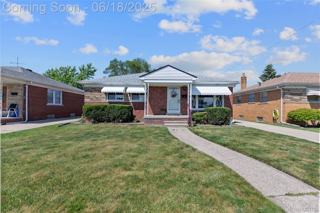 19045 Morningside Ave, Eastpointe, MI 48021 - view of front of property with brick siding and a front lawn