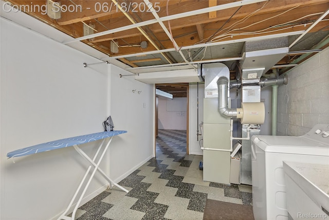 19045 Morningside Ave, Eastpointe, MI 48021 - finished below grade area with washer / clothes dryer, tile patterned floors, heating unit, and concrete block wall