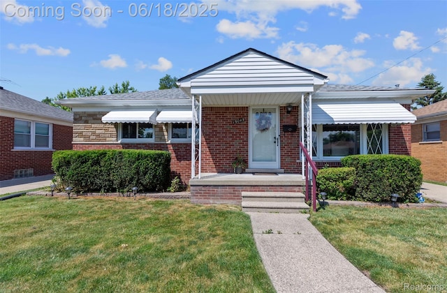 19045 Morningside Ave, Eastpointe, MI 48021 - bungalow-style house with a front yard, brick siding, and a porch