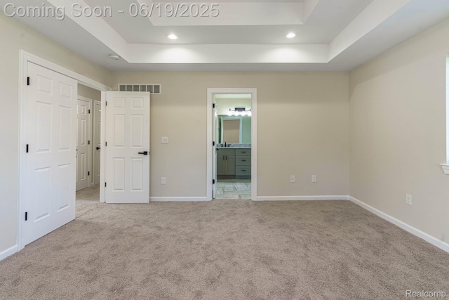 23013 Helen, Southfield, MI 48033 - unfurnished bedroom featuring carpet flooring, a tray ceiling, recessed lighting, and ensuite bath
