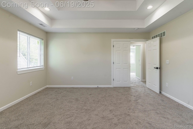 23013 Helen, Southfield, MI 48033 - carpeted empty room with healthy amount of natural light, a raised ceiling, and recessed lighting