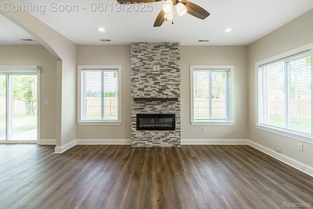 23013 Helen, Southfield, MI 48033 - unfurnished living room with dark wood-style flooring, ceiling fan, a fireplace, arched walkways, and recessed lighting