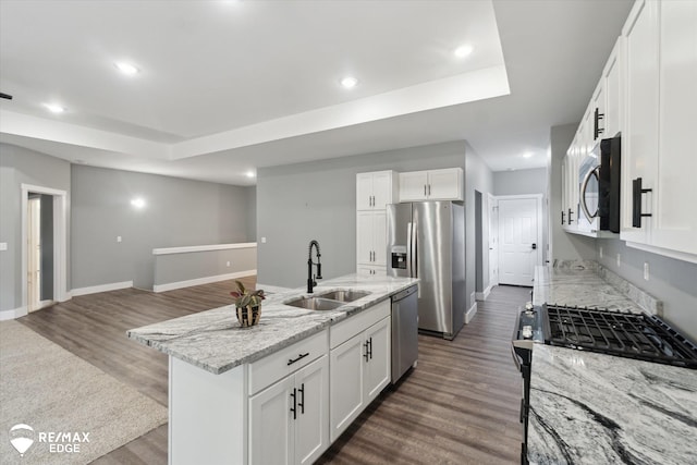 3113 Harbor Pointe Cir, Fenton, MI 48430 - kitchen featuring appliances with stainless steel finishes, dark wood-type flooring, light stone counters, white cabinetry, and recessed lighting