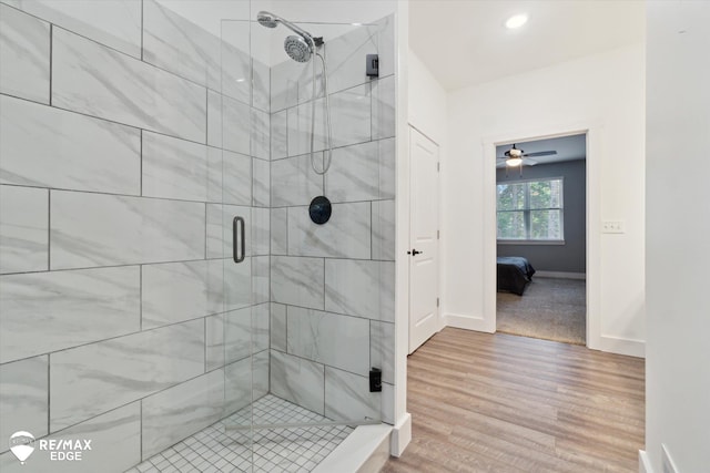 3113 Harbor Pointe Cir, Fenton, MI 48430 - ensuite bathroom featuring a shower stall, wood finished floors, and recessed lighting