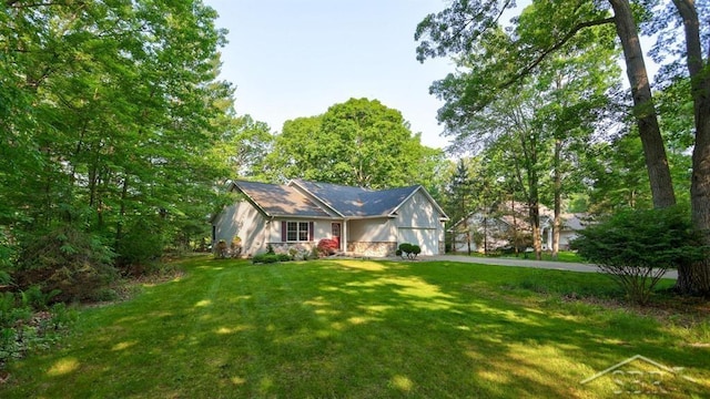 878 S Crooked Tree Ln, Midland, MI 48640 - view of front of property with a garage, a front lawn, and driveway