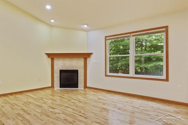 878 S Crooked Tree Ln, Midland, MI 48640 - unfurnished living room with wood finished floors, recessed lighting, and a fireplace